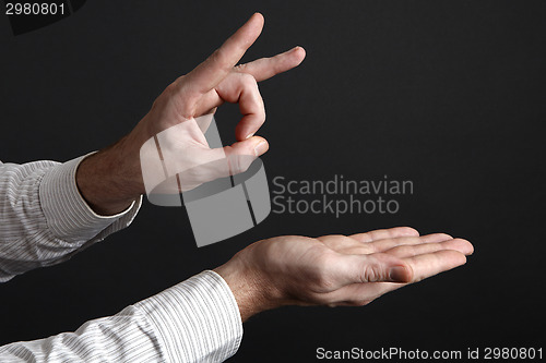Image of Caucasian male hands shoot away something