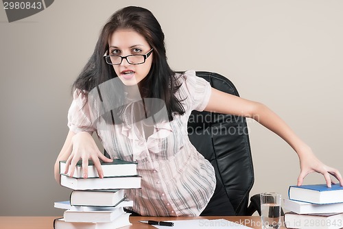 Image of Beautiful businesswoman in office