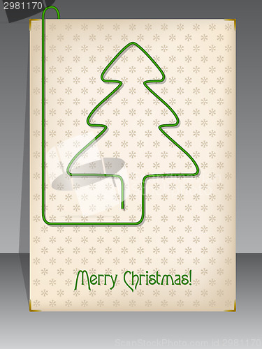 Image of Christmas card with christmas tree shaped paper clip
