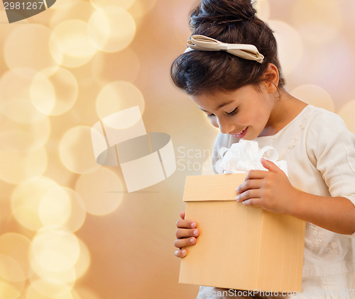 Image of smiling little girl with gift box