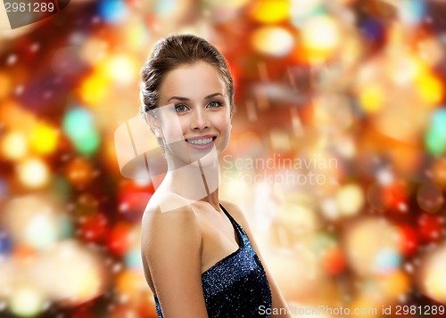 Image of smiling woman in evening dress