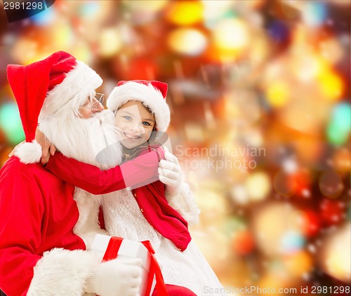 Image of smiling little girl with santa claus