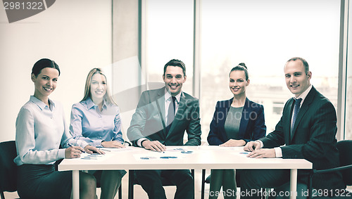 Image of smiling business team at meeting