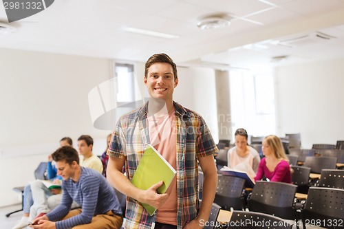 Image of group of smiling students in lecture hall