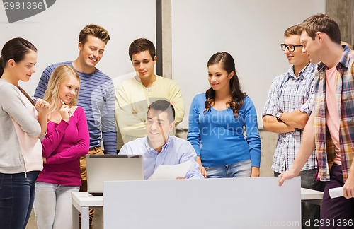 Image of group of students and teacher with laptop