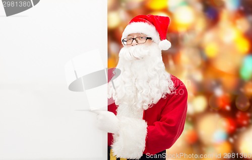 Image of man in costume of santa claus with billboard