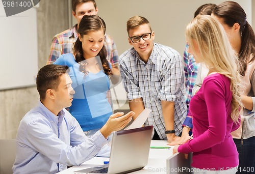 Image of group of students and teacher with laptop