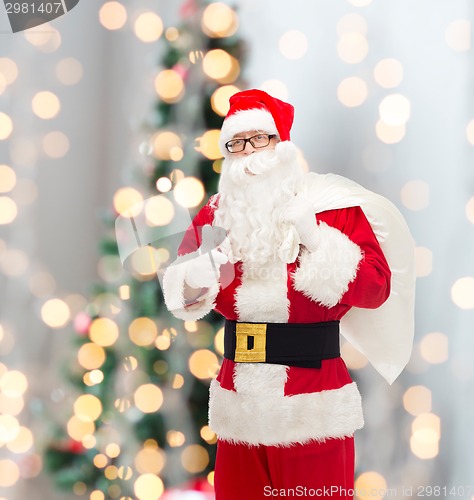 Image of man in costume of santa claus with bag