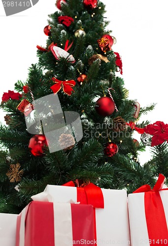 Image of close up of christmas tree and presents