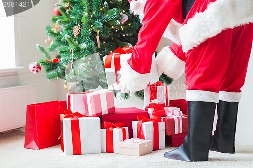 Image of close up of santa claus with presents