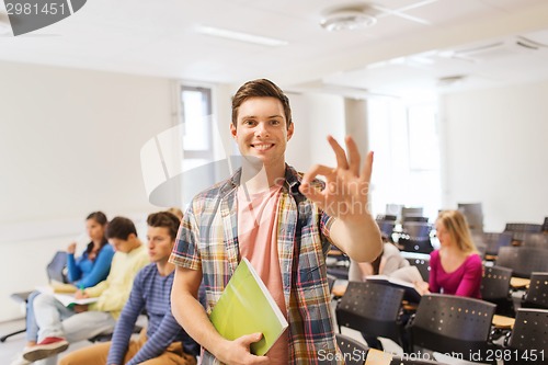 Image of group of smiling students in lecture hall