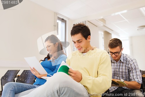 Image of group of smiling students in lecture hall