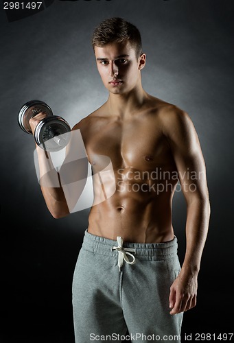 Image of young man with dumbbell