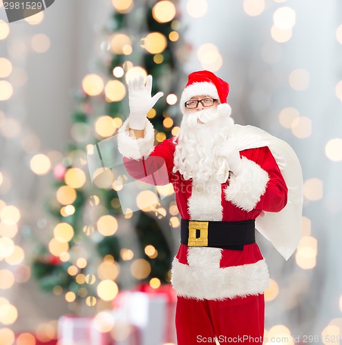 Image of man in costume of santa claus with bag