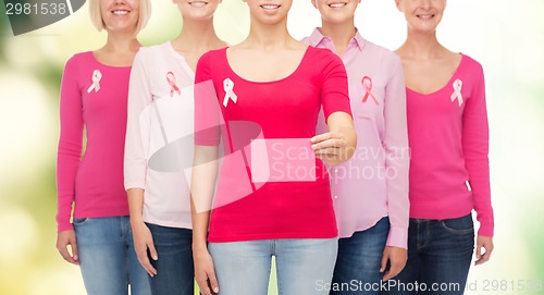 Image of close up of women with cancer awareness ribbons