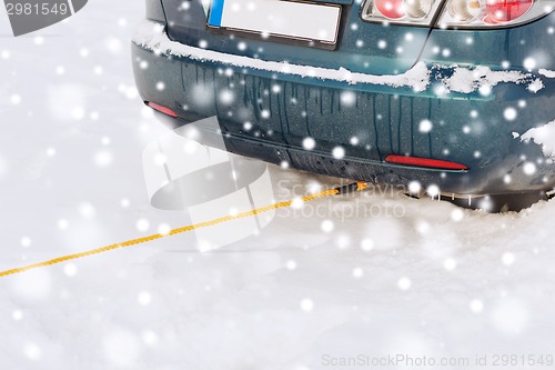 Image of closeup of towed car with towing rope