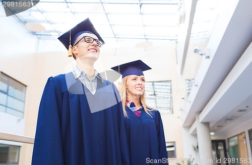 Image of group of smiling students in mortarboards