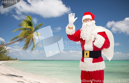 Image of man in costume of santa claus with bag