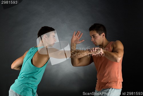 Image of young men wrestling