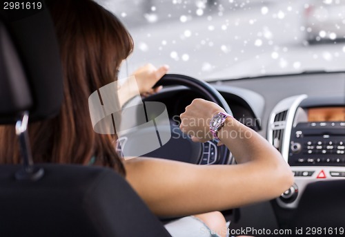 Image of close up of businesswoman driving car