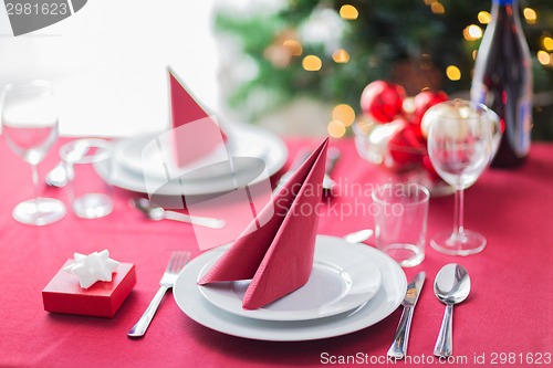 Image of room with christmas tree and decorated table