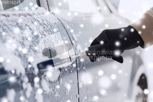 Image of close up of man with car key outdoors