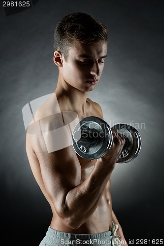 Image of young man with dumbbell