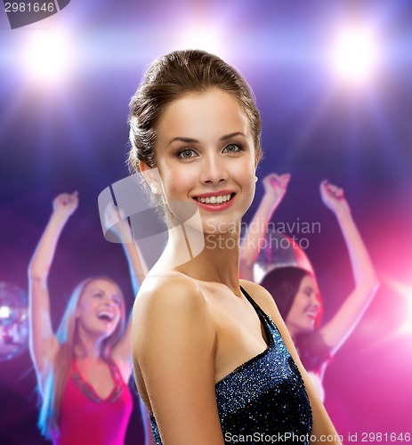 Image of smiling woman in evening dress