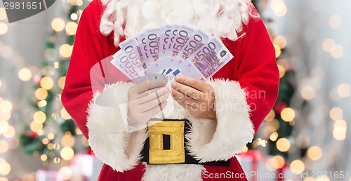 Image of close up of santa claus with euro money