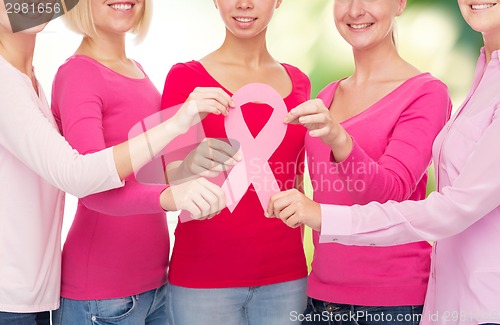 Image of close up of women with cancer awareness ribbons