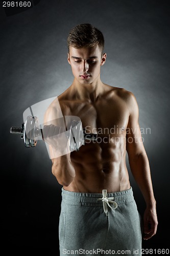 Image of young man with dumbbell