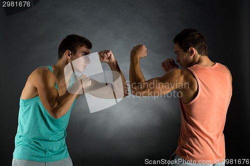 Image of young men wrestling