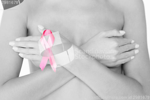 Image of naked woman with breast cancer awareness ribbon