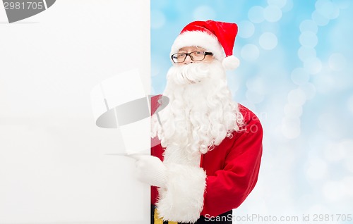 Image of man in costume of santa claus with billboard