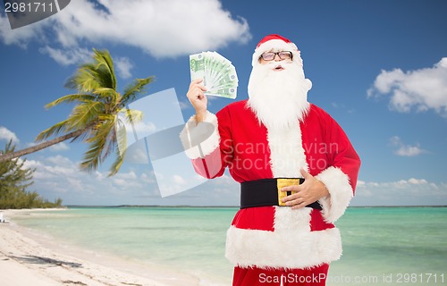 Image of man in costume of santa claus with euro money