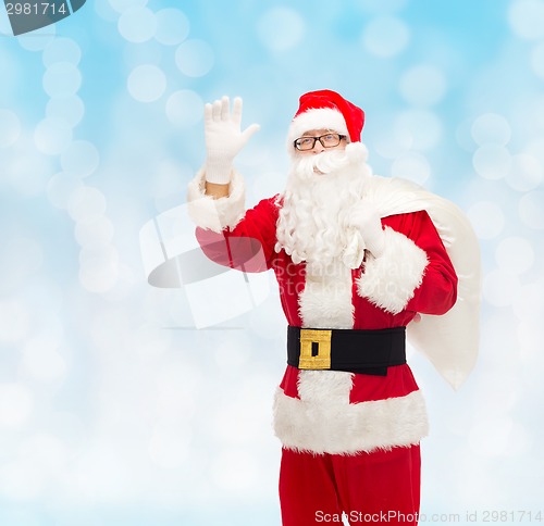 Image of man in costume of santa claus with bag