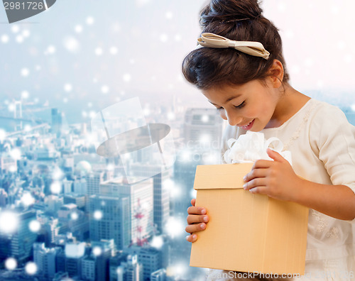 Image of smiling little girl with gift box