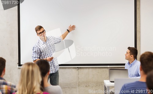 Image of group of students and teacher in classroom