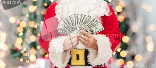 Image of close up of santa claus with dollar money