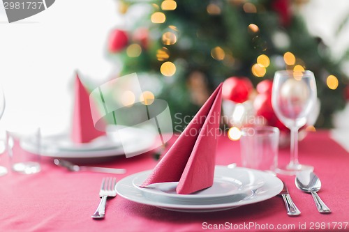 Image of room with christmas tree and decorated table