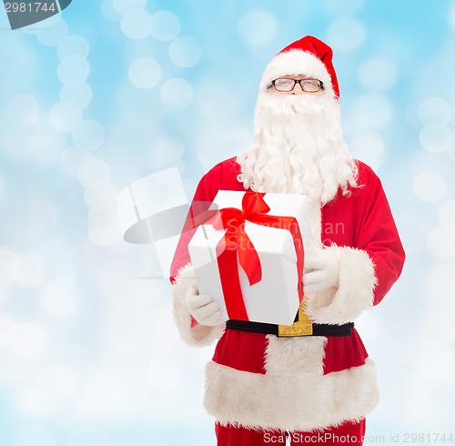 Image of man in costume of santa claus with gift box