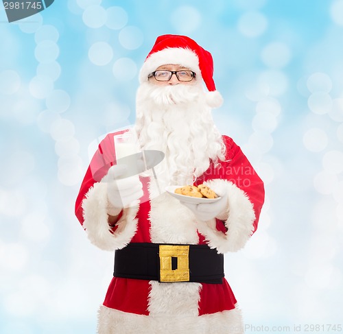Image of santa claus with glass of milk and cookies