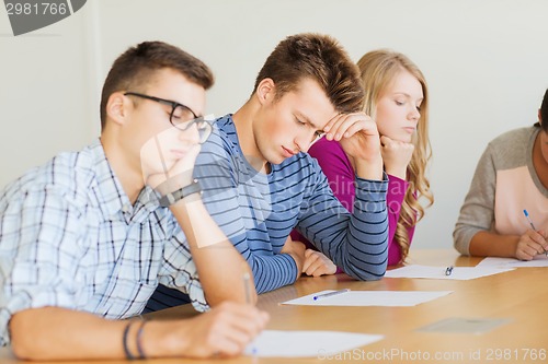 Image of group of students with papers