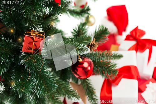 Image of close up of christmas tree and presents