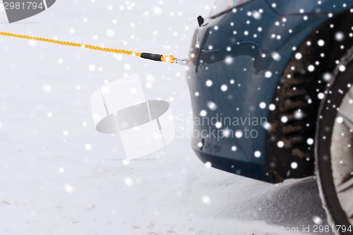 Image of closeup of towed car with towing rope