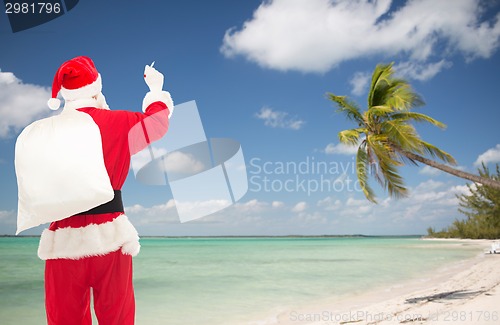 Image of man in costume of santa claus with bag