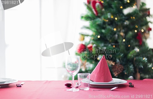 Image of room with christmas tree and decorated table