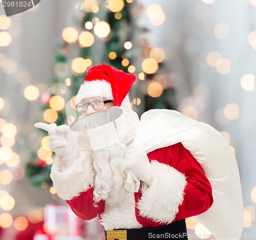 Image of man in costume of santa claus with bag