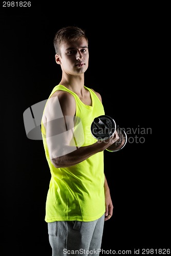 Image of young man with dumbbell