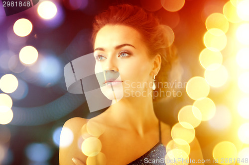 Image of woman with diamond earrings